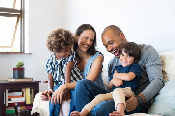 Family having fun on a couch - Keep pests away from your home with Ja-Roy Pest Control Baton Rouge, LA