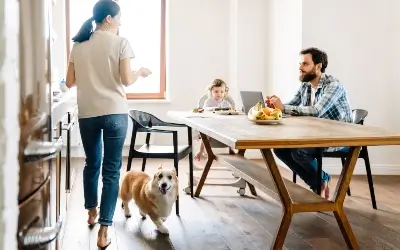 Happy family in the kitchen - Pet-Friendly Ant Control Tips for Louisiana Homes