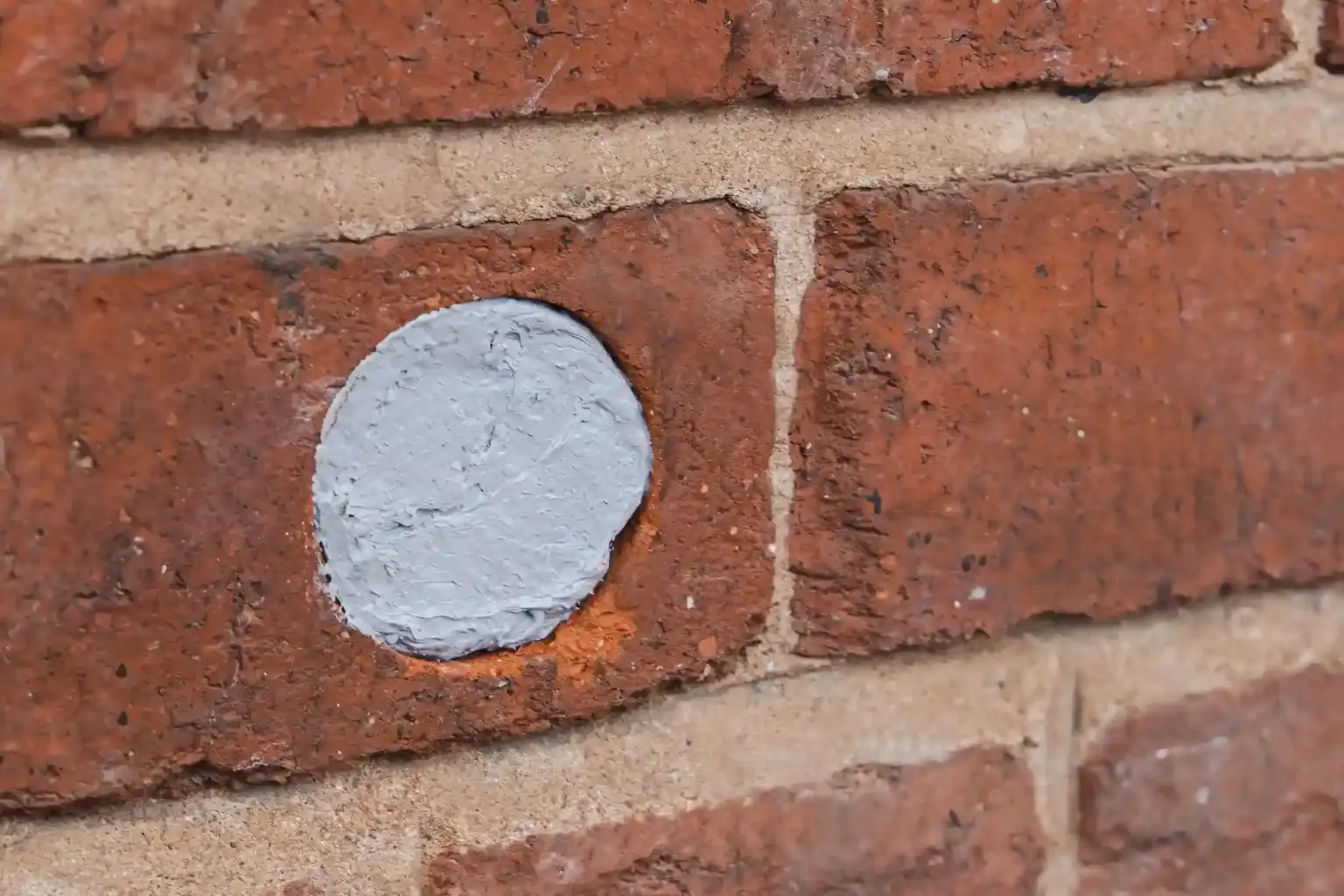 Flexi armor rodent control applied to a hole in a brick wall